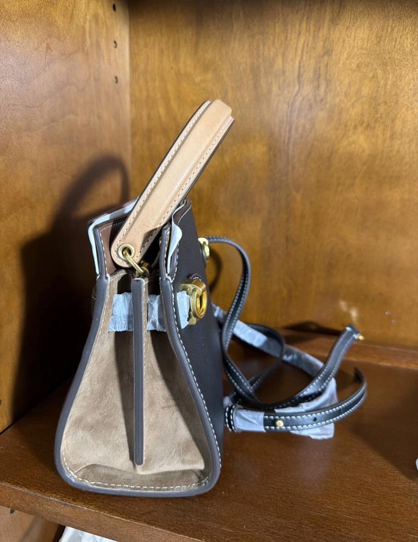 The Tory Burch Women's Petite Lee Radziwill Leather Double Bag in black is crafted from smooth leather and features a decorative gold-tone lock closure