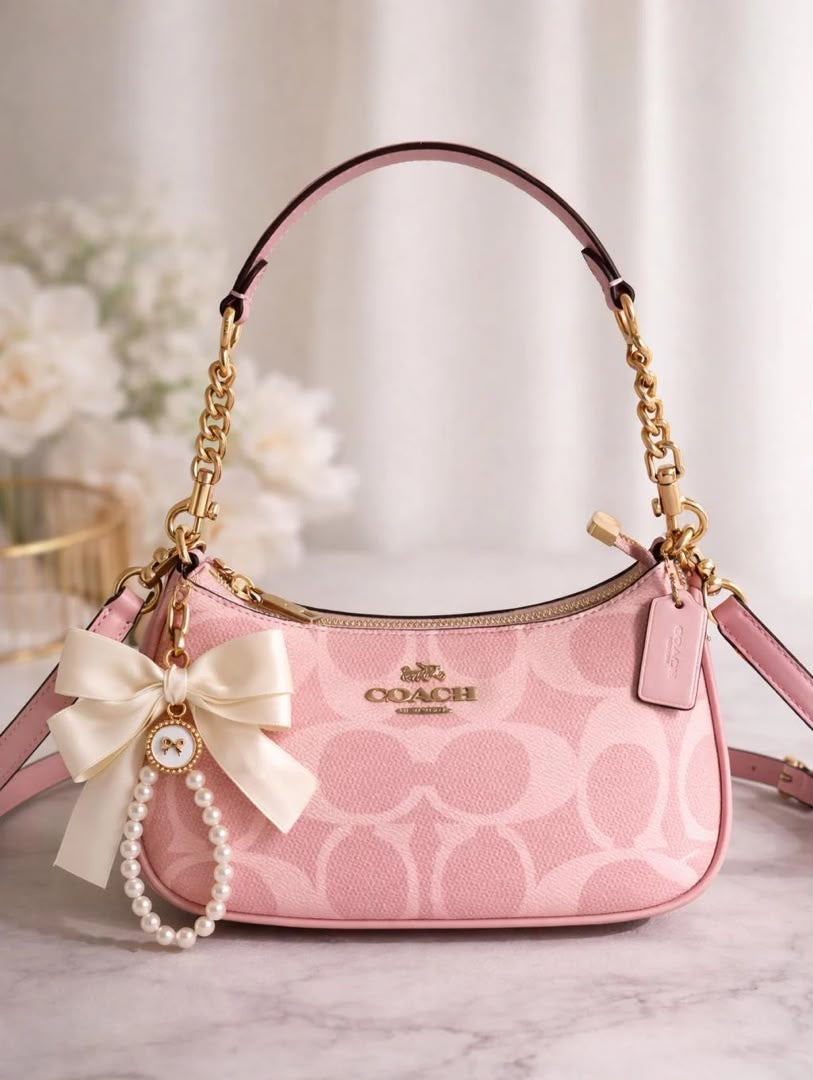 Teri shoulder bag in powder pink signature canvas
