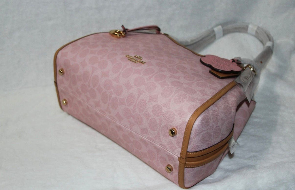 Coach Erin shoulder bag in powder pink signature canvas with smooth leather trim.