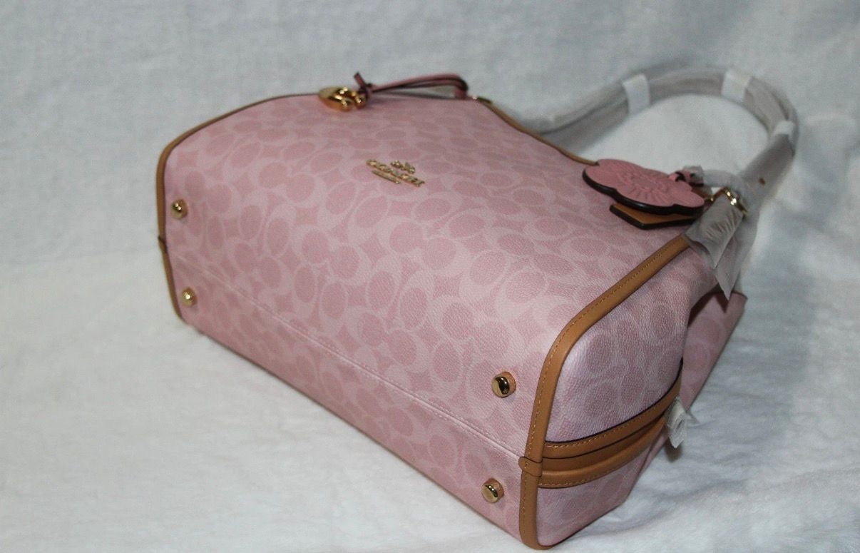 Coach Erin shoulder bag in powder pink signature canvas with smooth leather trim.