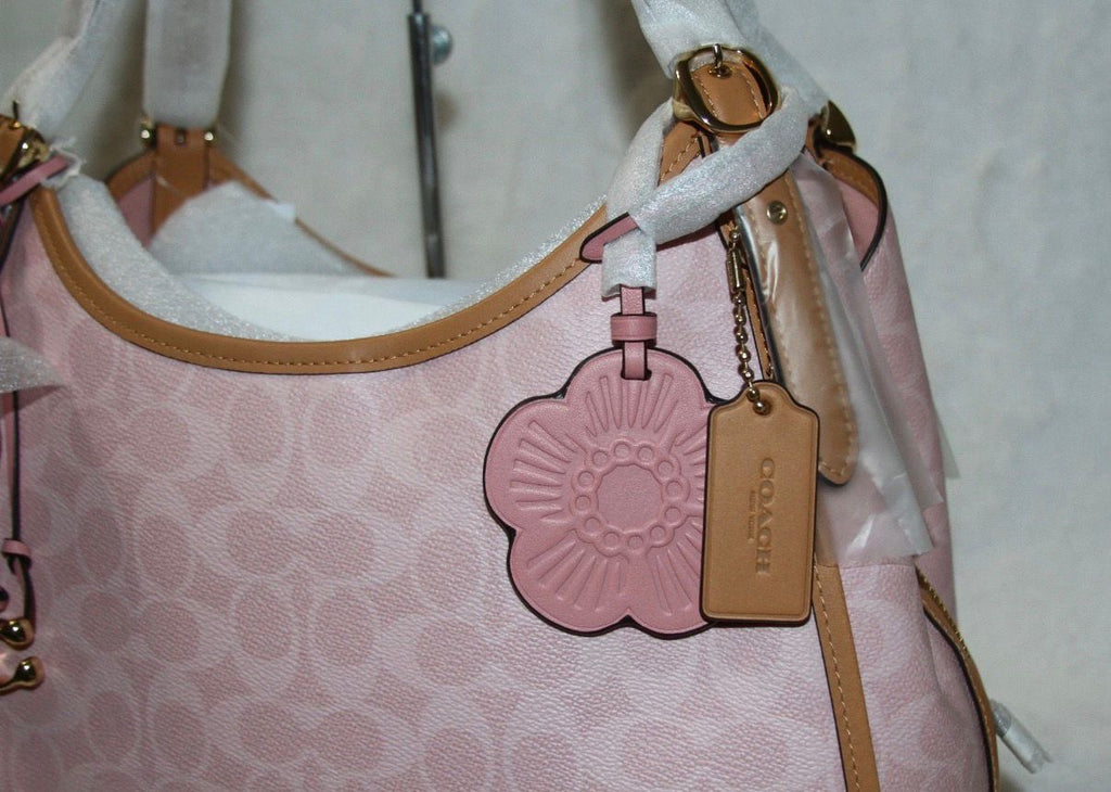 Coach Erin shoulder bag in powder pink signature canvas with smooth leather trim.