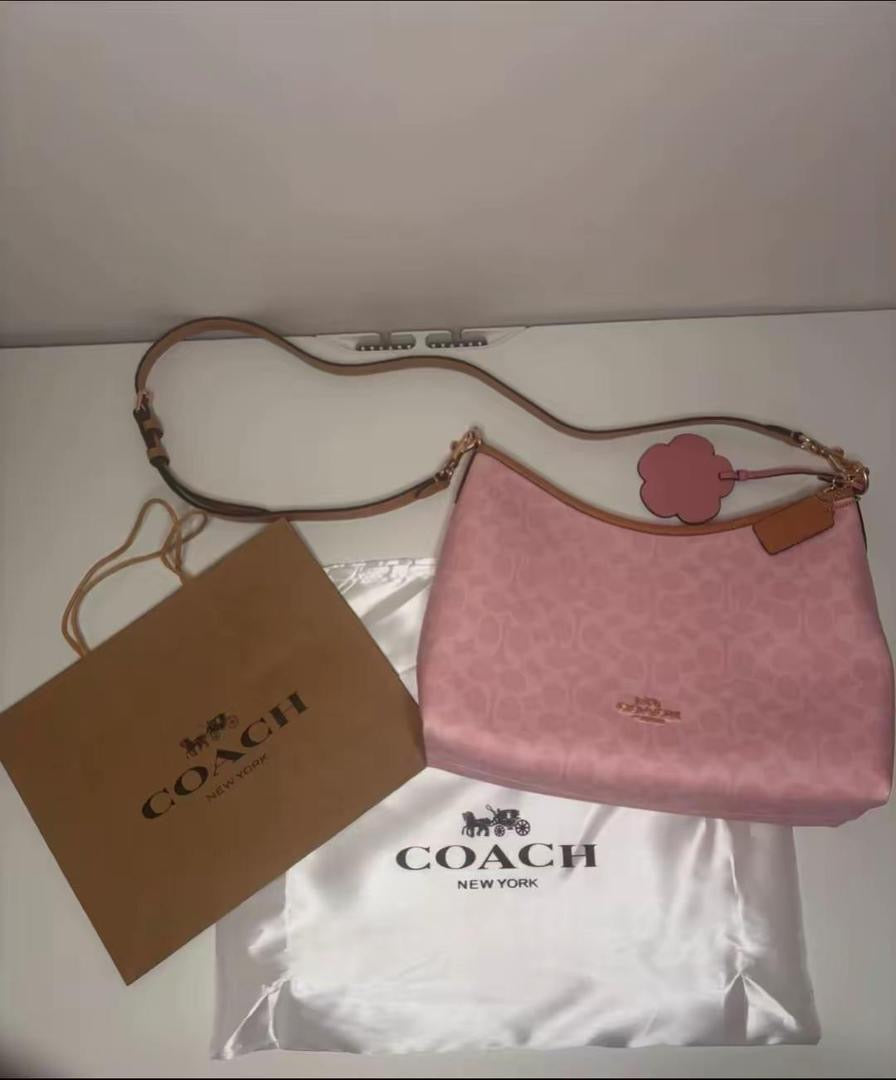 Coach Gold/Powder Pink Laurel
Shoulder Bag With Charms
Signature