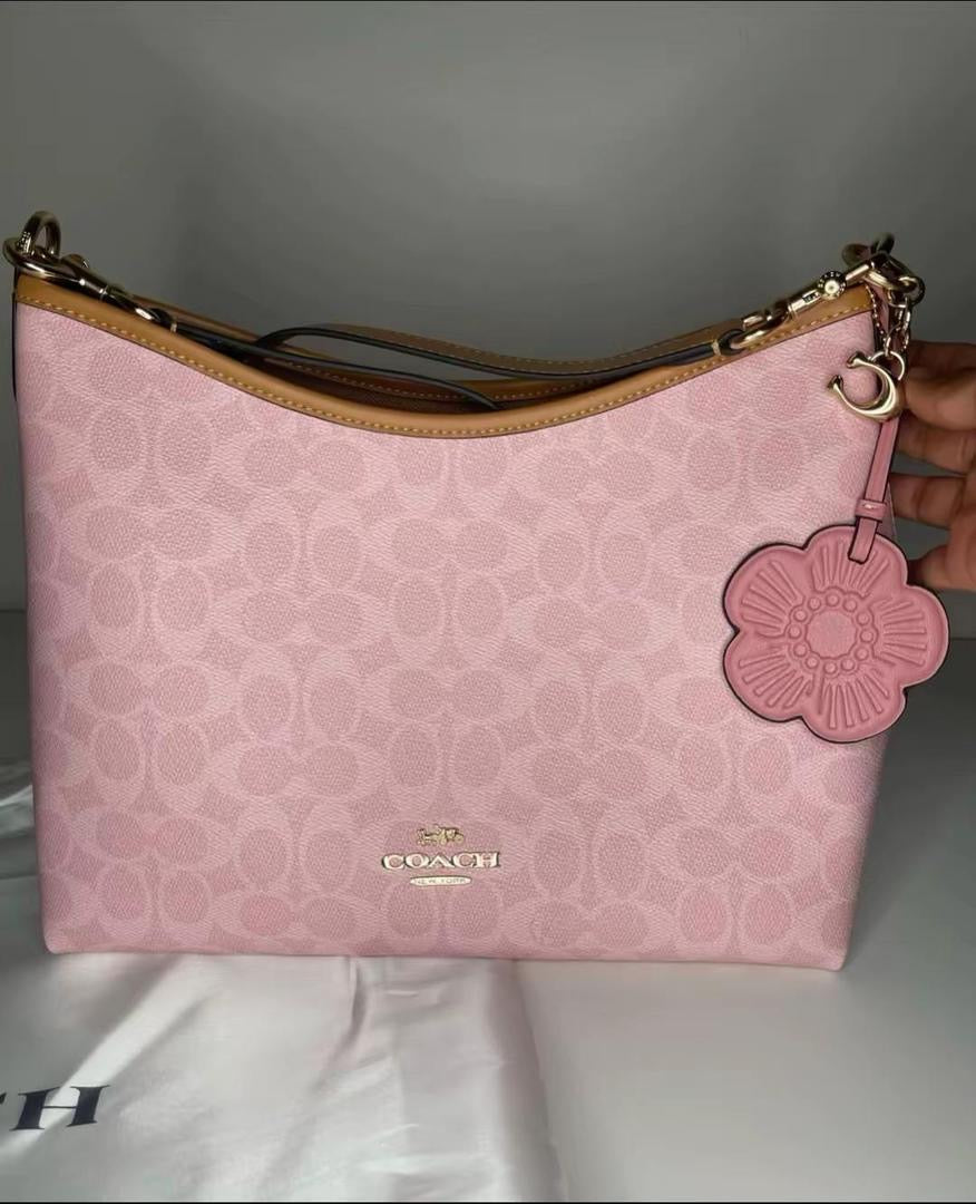 Coach Gold/Powder Pink Laurel
Shoulder Bag With Charms
Signature