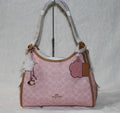 Coach Erin shoulder bag in powder pink signature canvas with smooth leather trim.