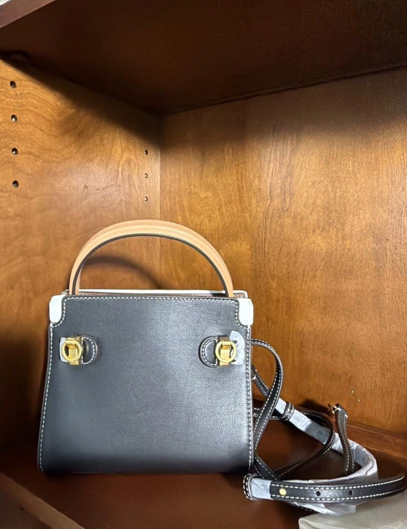 The Tory Burch Women's Petite Lee Radziwill Leather Double Bag in black is crafted from smooth leather and features a decorative gold-tone lock closure