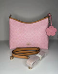 Coach Gold/Powder Pink Laurel
Shoulder Bag With Charms
Signature