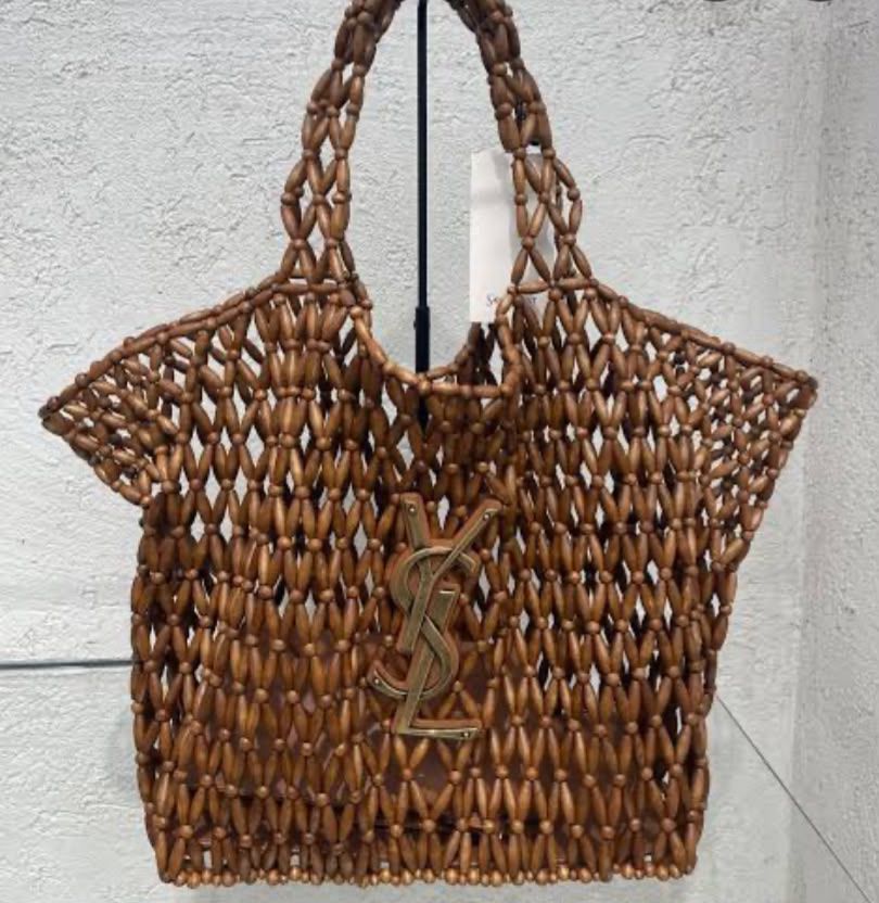 Saint Laurent Icare Medium beaded shopper bag featuring brown wooden beads and a gold Cassandre logo